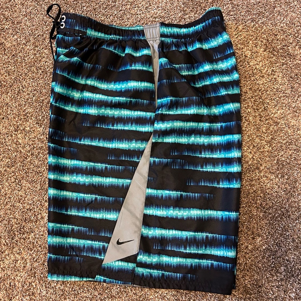 Nike Men’s XXL Swim Trunks, has a smalll flaw under the drawstring